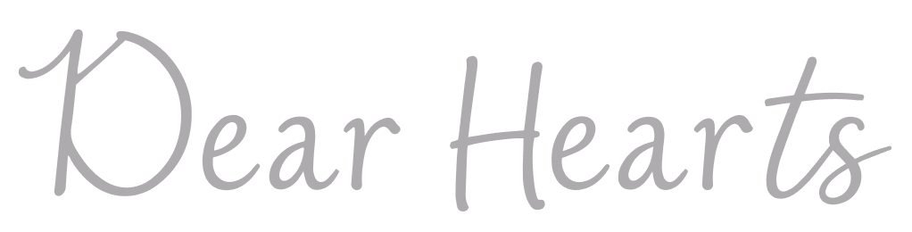 Stylized text logo reading Dear Hearts in cursive font.